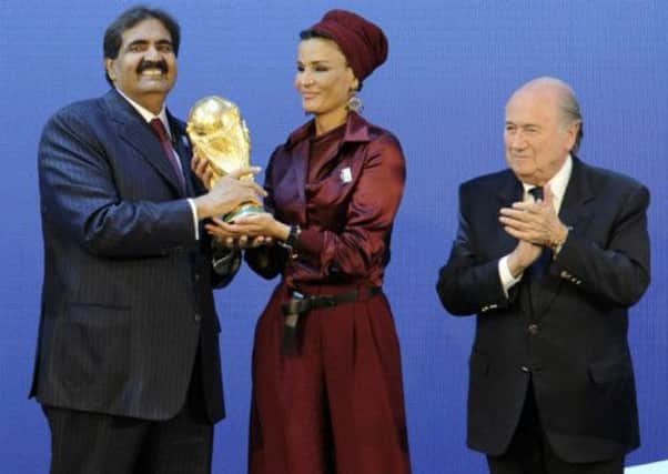Emir of Qatar Sheikh Hamad bin Khalifa Al-Thani and his wife Sheikha Moza bint Nasser Al-Missned at the announcement of the Qatar World Cup. Picture: Getty