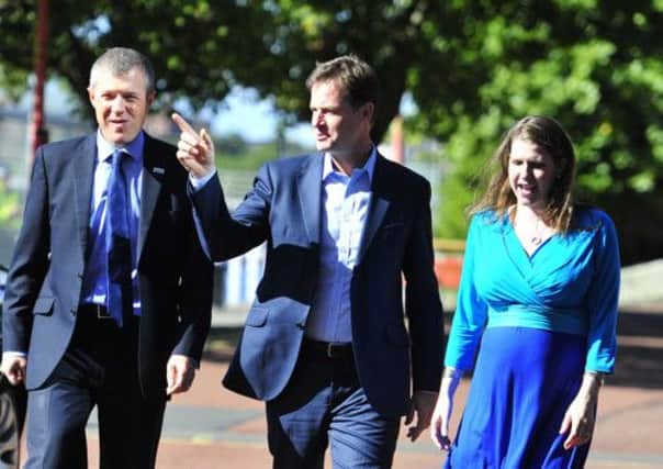 Nick Clegg arrives at Glasgow's SECC flanked by Willie Rennie and Jo Swinson. Picture: Robert Perry