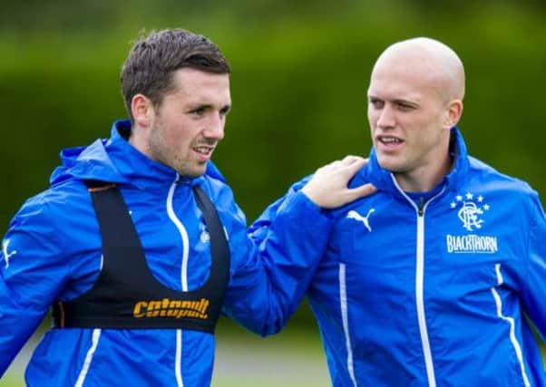 Nicky Clark, left and Nicky Law limber up in training ahead of the match against Queen of the South. Picture: SNS