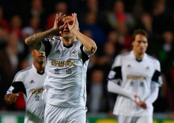 Jonjo Shelvey went from hero, to villain and back to hero at the Liberty Stadium last night. Picture: Getty