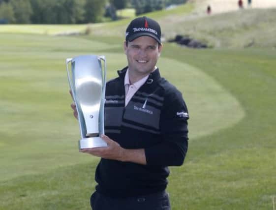 Zach Johnson poses with the BMW Championship trophy. Picture: AP