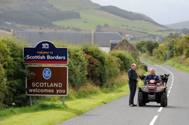 Simon Orpwood whose Northumberland farm sits on the Border, discusses independence with Scottish neighbour Hugh Veitch. Picture: Ian Rutherford