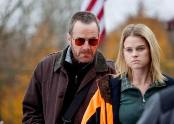 Bryan Cranston as Topo and Alice Eve as Chloe in Cold Comes The Night
