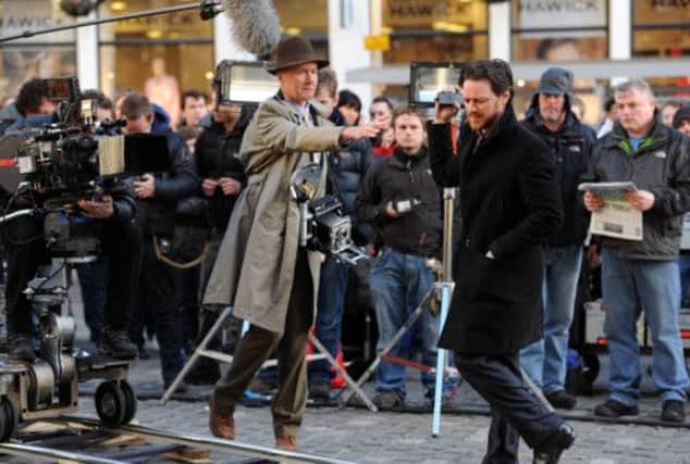 Writer Irvine Welsh, left, and actor James McAvoy on the set of Filth in Edinburghs Grassmarket. Picture: Ian Rutherford