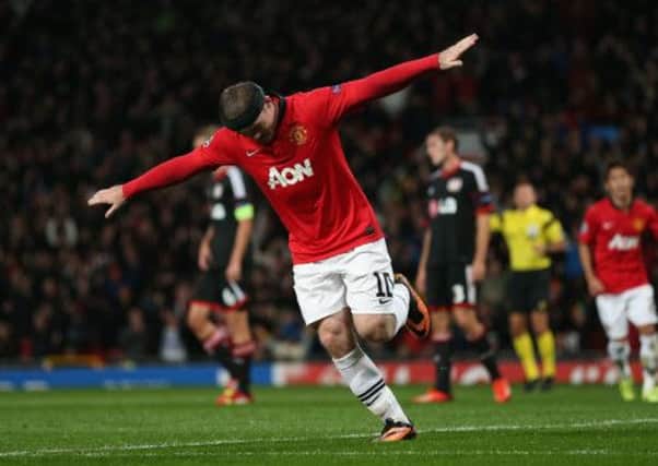 Wayne Rooney celebrates scoring the opening goal. Picture: Getty