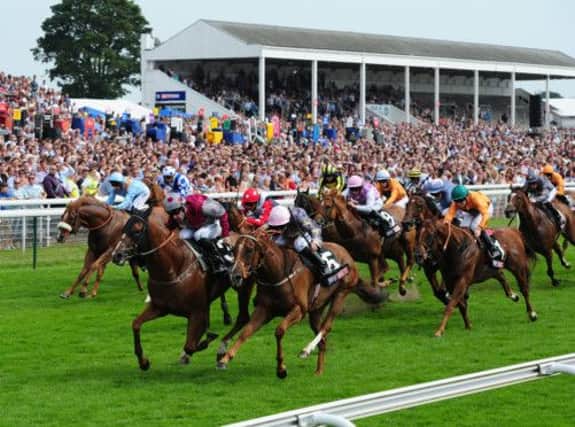 Robert Winston, spotted cap, coaxes Tropics to victory at York. Dean Ivory hopes for more of the same in Saturdays Ayr Gold Cup. Picture: PA