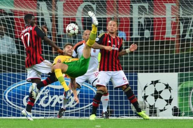 Charlie Mulgrew goes for the spectacular while sandwiched between Cristian Zapata and Philippe Mexes. Picture: Getty