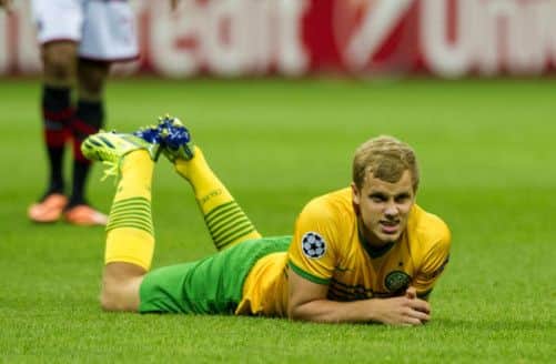 Striker Teemu Pukki lies on the San Siro turf at fulltime. Picture: Craig Williamson/SNS