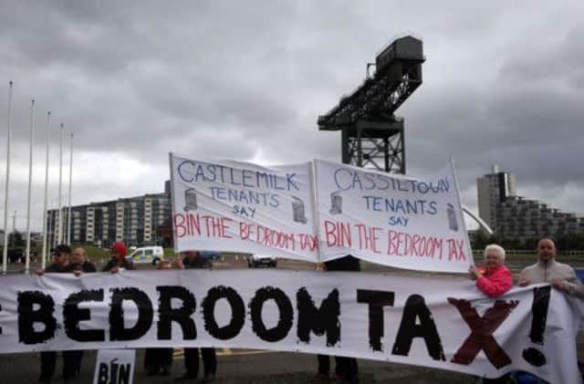 Protesters make their feelings known as they demonstrate outsiden the Lib Dem Party conference in Glasgow. Picture: PA