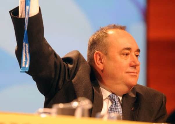 Alex Salmond votes on the Nato resolution at last years party conference. Picture: Dan Phillips