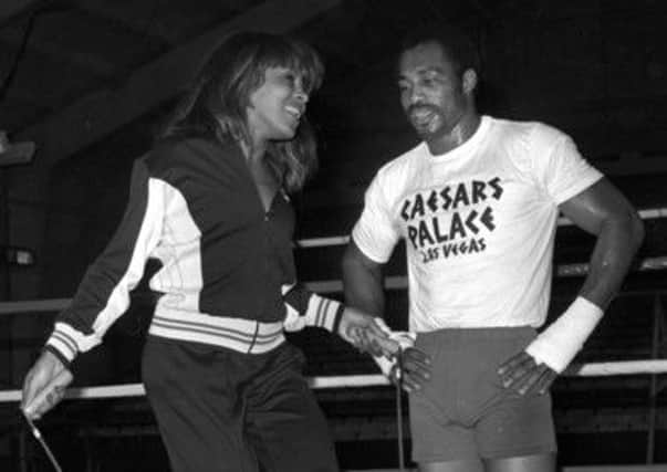 Former heavyweight champion Ken Norton with singer Tina Turner at Caesars Palace in 1977. Picture: AP