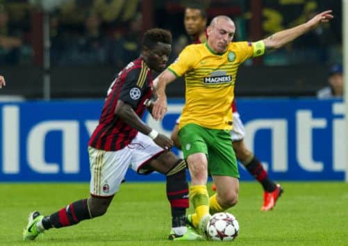 Sulley Muntari, left, battles it out with Celtic captain Scott Brown. Picture: SNS