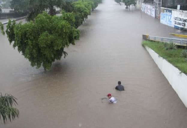 People swim on the streets of Culiacan, in Sinaloa state. Picture: Reuters