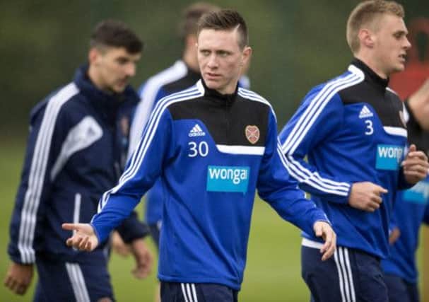 Jordan McGhee has seized his chance as Hearts have been forced to put their faith in youth. Picture: SNS