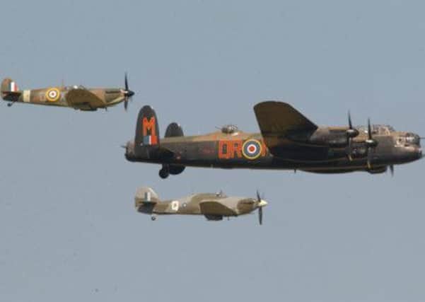 Battle of Britain memorial flight showing a Spitfire, a Hurricane and the Lancaster Bomber. Picture: Paul Parke