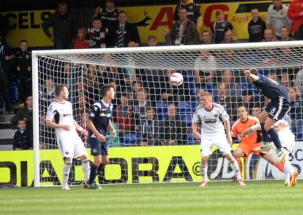 Richard Brittain scores a dramatic 90th minute winner for Ross County. Picture: SNS