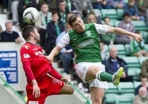 Hibernian's Paul Hanlon is put under pressure by Steven Thompson. Picture: SNS
