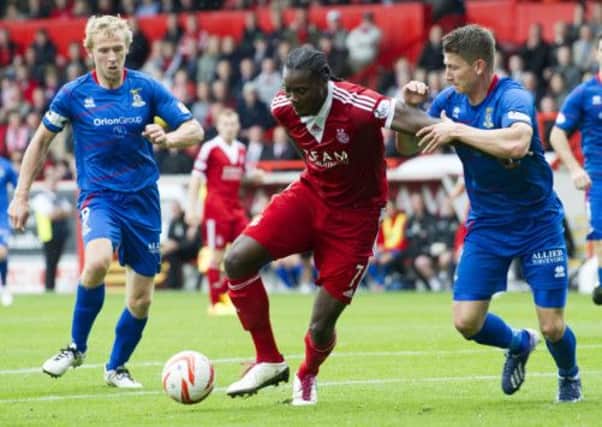 Calvin Zola (centre) is closed down by ICT's Richie Foran and Josh Meekings (right). Picture: SNS
