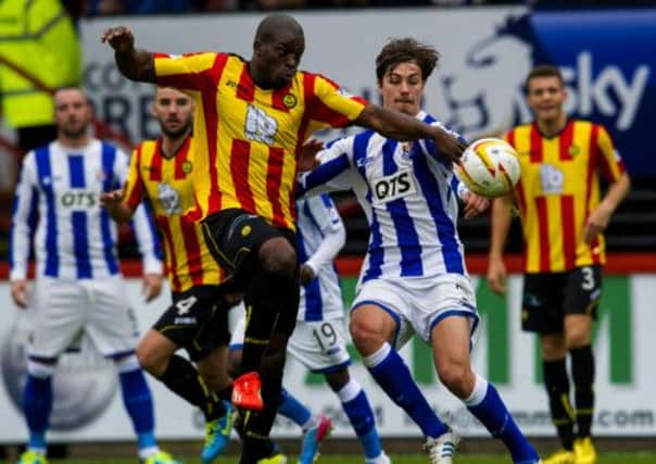 Partick Thistle's Isaac Osbourne holds off counterpart Jackson Irvine (right). Picture: SNS