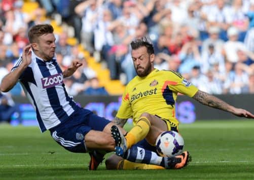 Steven Fletcher challenges international team-mate James Morrison during Sunderland's 3-0 defeat to West Brom. Picture: AFP