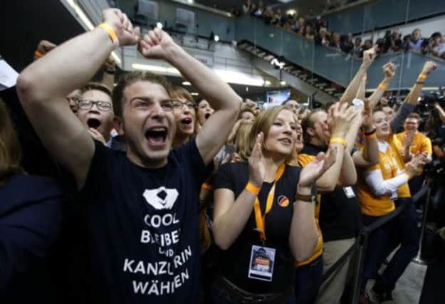 CDU members acclaim victory at party headquarters in Berlin. Picture: Reuters