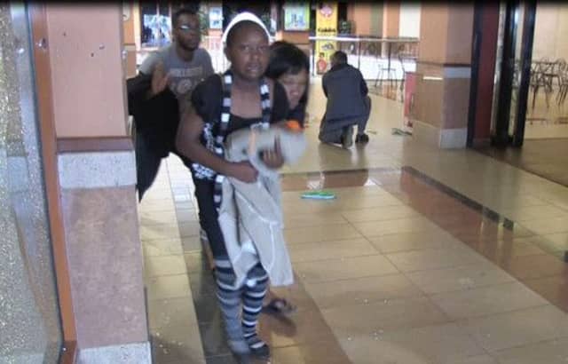 Civilians take cover following an attack by masked gunmen in a shopping mall in Nairobi. Picture: Getty