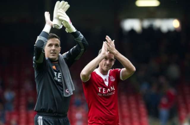 Jamie Langfield (left) and Scott Vernon celebrate their side's victory at full time. Picture: SNS