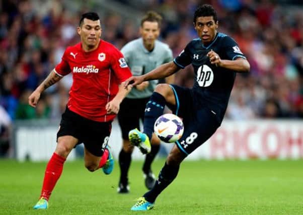 Paulinho of Tottengam and Gary Medel of Cardiff. Picture: Getty