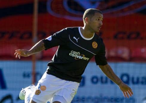 Lionel Ainsworth wheels away after scoring against Dundee United. Picture: PA