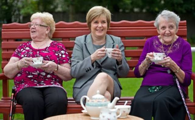 Nicola Sturgeon shares a cuppa with May McAleese and Margaret Parker at the launch of the SNP's pensions report at a Glasgow sheltered housing complex. Picture: Wattie Cheung