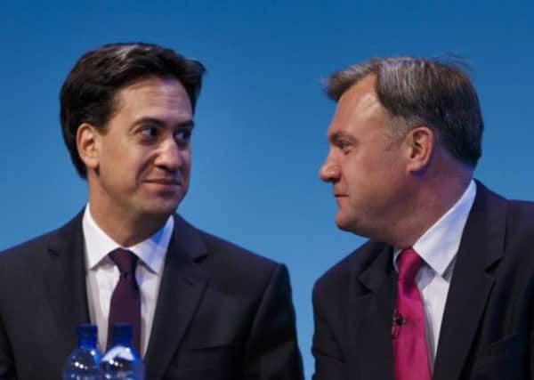 Labour leader Ed Miliband, left, and Ed Balls in conference ahead of the shadow chancellor's speech to delegates. Picture: PA