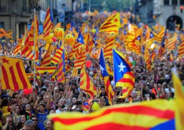 Supporters of independence for Catalonia on the streets of Barcelona last year. Picture: Getty