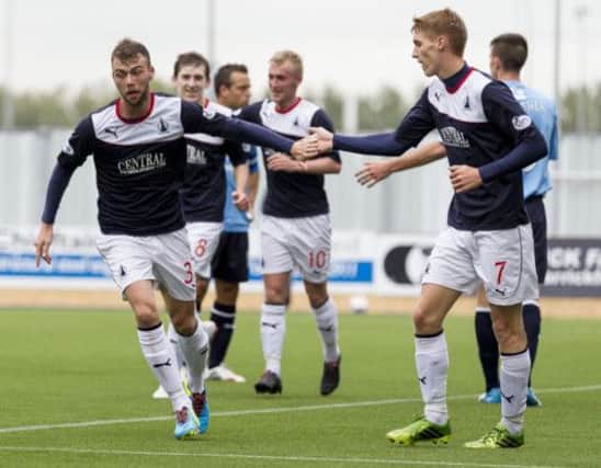 Rory Loy, left, helped Falkirk beat Dundee 3-0 on their artificial surface at the weekend. Picture: SNS