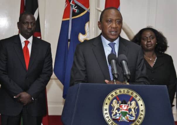Kenyan President Uhuru Kenyatta, centre, has declared three days of national mourning. Picture: AP