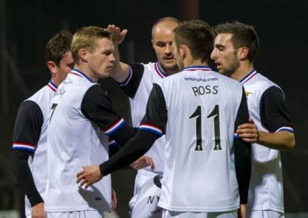 Billy McKay (left) celebrates his goal with team mates. Picture: SNS