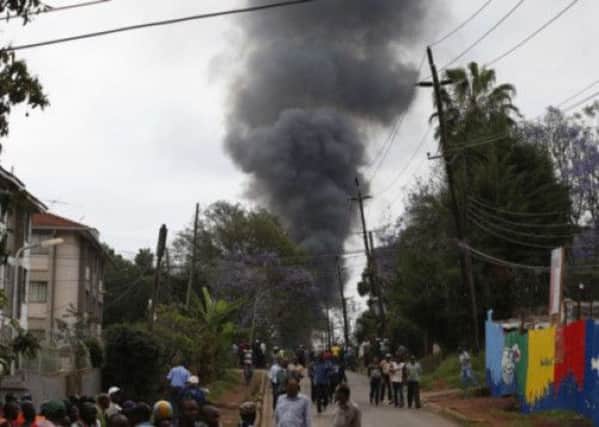Black smoke rises over the Westgate mall as a result of a fire started by the terrorists. Picture: Reuters