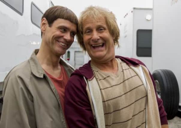 Jim Carrey and Jeff Daniels in character as Lloyd Christmas and Harry Dunne on the set of Dumb and Dumber To. Picture: AP