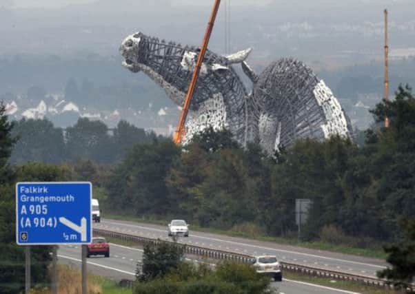 Scotland's tallest works of art, a pair of horse head sculptures known as The Kelpies, beside the M9. Picture: Saltire News and Sport