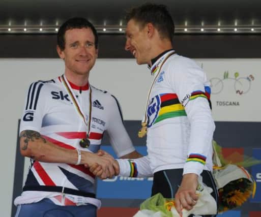 Bradley Wiggins shakes hands with Tony Martin on the world championships time trial podium. Picture: AP