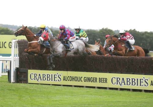 Raajih, centre, under Jason Maguire, wins at Perth. Picture: John Grossick