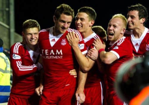 Scott Vernon, second left, is congratulated on his second goal by team-mates. Picture: SNS