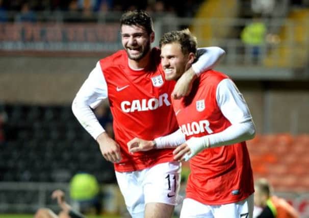 David Goodwillie celebrates his opening goal with Dundee Utd team-mate Nadir Ciftci. Picture: SNS