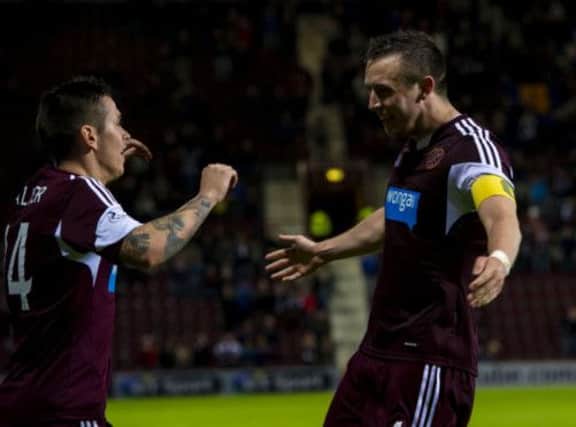 Hearts captain Danny Wilson celebrates his goal in extra-time with Jamie Walker. Picture: SNS