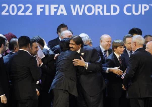 Qatar's Emir, Sheikh Hamad bin Khalifa al-Thani, centre, after winning the right to host the 2022 World Cup in 2010. Picture: Getty