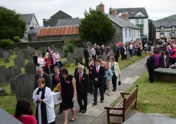 The coffin of schoolgirl April Jones is carried by family members into St Peter's Church for her funeral. Picture: Getty