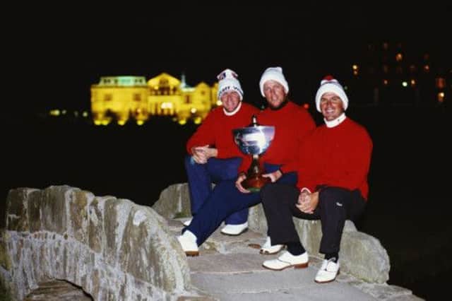 From left, John Daly,Payne Stewart and Fred Couples of the United States celebrate on the Swilcan Bridge. Picture: Getty