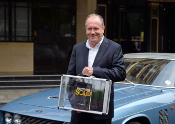 William Boyd poses with his new James Bond novel Solo. Picture: Getty