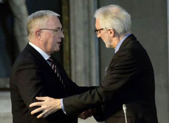 Pat McQuaid, left, shakes hands with newly-elected UCI president Brian Cookson. Picture: AFP/Getty