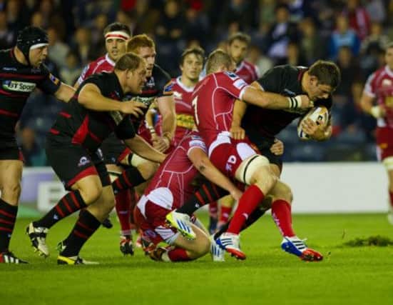 Scarlets John Barclay challenges Edinburgh captain Ross Ford. Picture: SNS