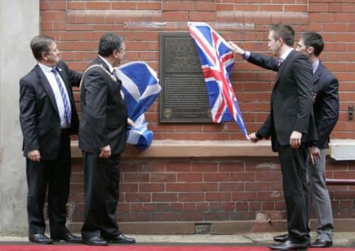 Keith Brown, Lord Provost Donald Wilson, Danny Wilson and former soldier David Timmons at Tynecastle. Picture: SNS
